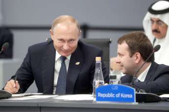 Владимир Путин и Максим Орешкин. Фото:  Михаил Метцель/ТАСС